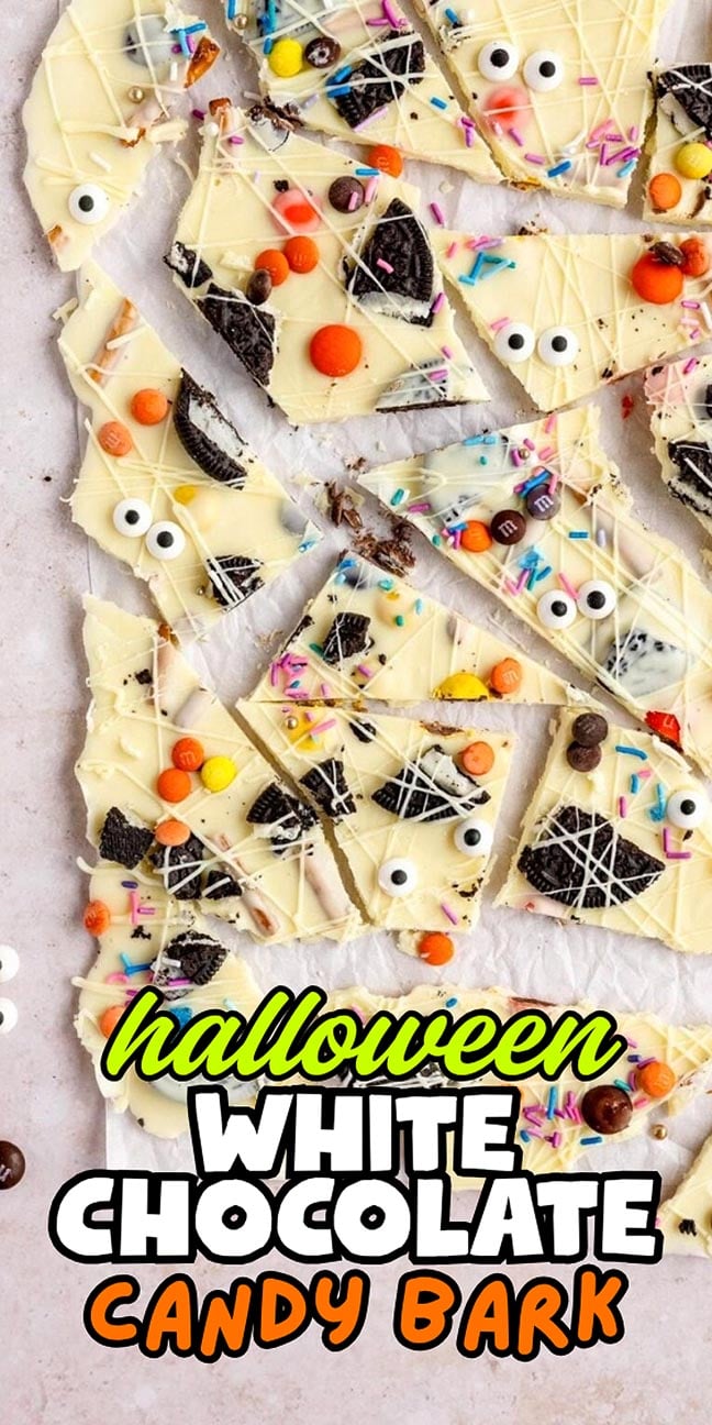 Pieces of Halloween white chocolate bark topped with candy eyes, cookie pieces, and colorful sprinkles.