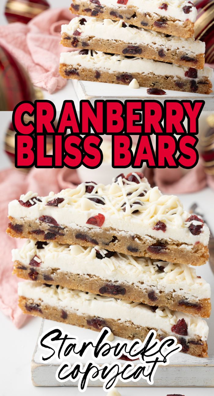Three easy cranberry bars topped with white chocolate and cranberries, stacked on a white board.