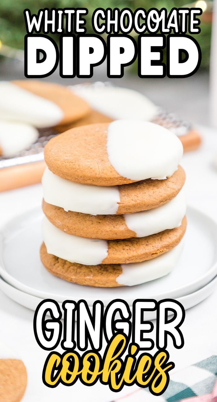 A stack of white chocolate dipped ginger cookies sits on a white plate, perfect for enjoying as Christmas ginger snap cookies.