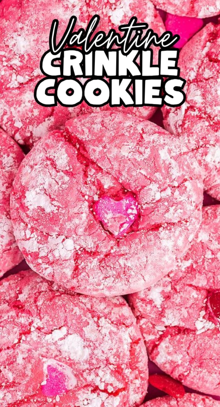 Pink Valentine crinkle cookies dusted with powdered sugar and topped with heart sprinkles—these easy Valentine’s cookies are perfect for sharing.