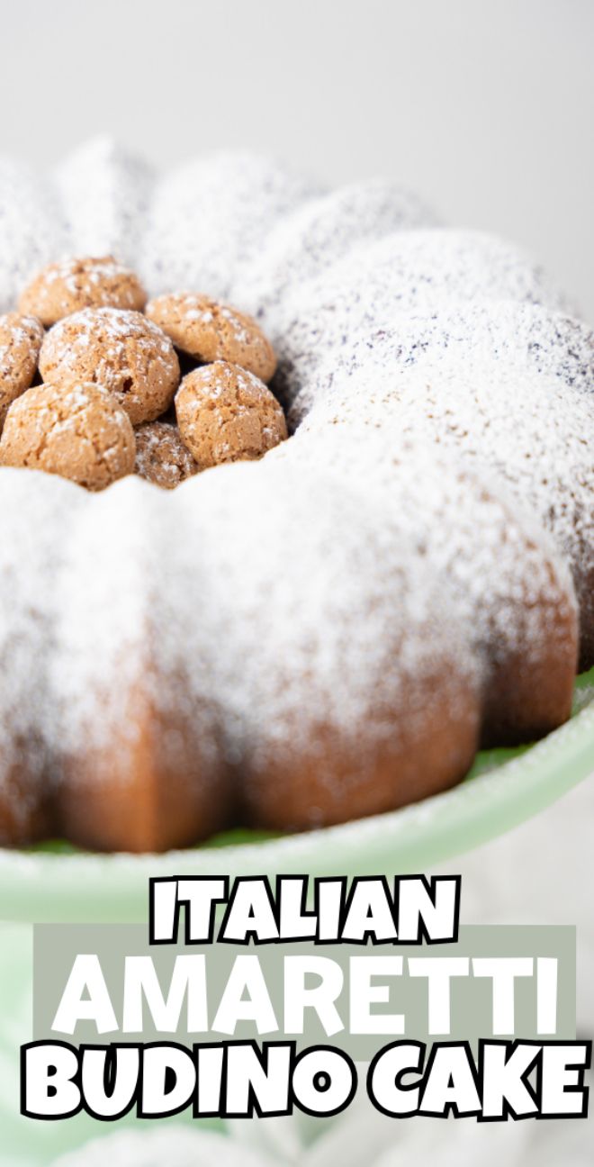 A bundt cake topped with amaretti cookies and powdered sugar, labeled "Italian Amaretti Budino Cake," made with amaretti cookies and ricotta cheese—perfect to serve at Christmas or other holidays.