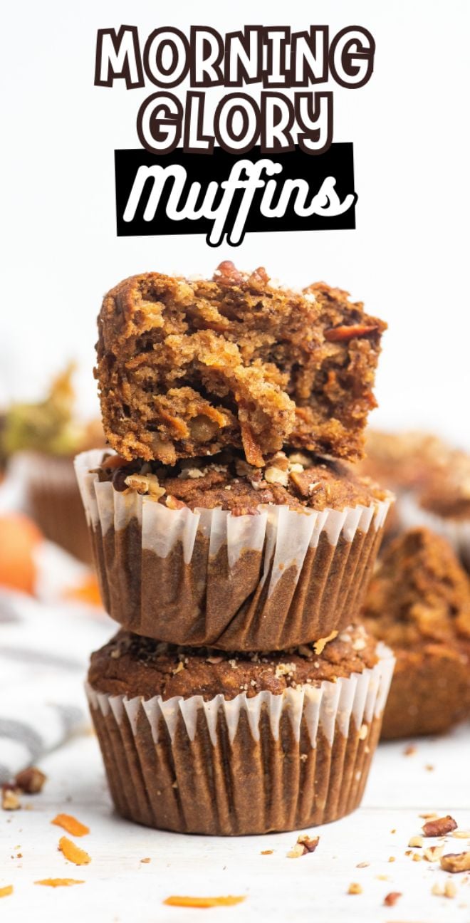 Three Morning Glory Muffins are stacked, with the top muffin split open to reveal its moist, textured interior—perfect for enjoying gluten free muffins any time of day.