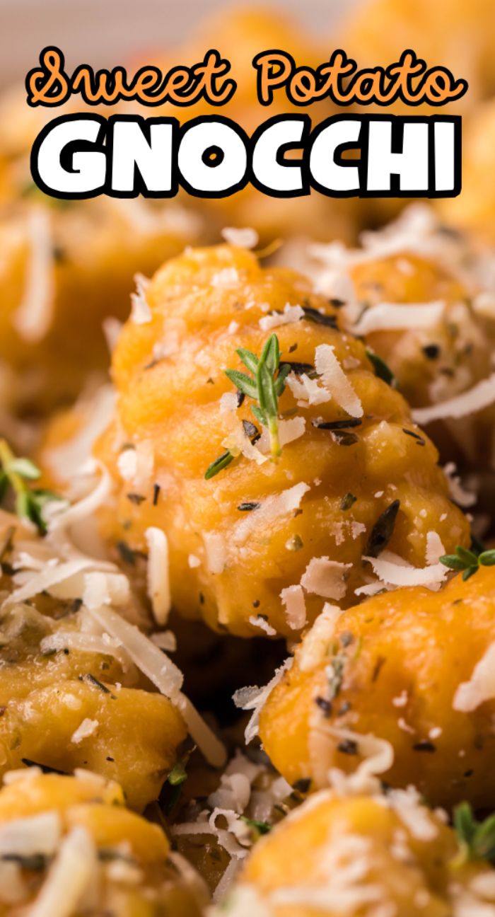Close-up of Sweet Potato Gnocchi topped with grated cheese, herbs, and a "Sweet Potato Gnocchi" label—perfect to pair with a roasted garlic sauce or try in your favorite homemade potato gnocchi recipe.