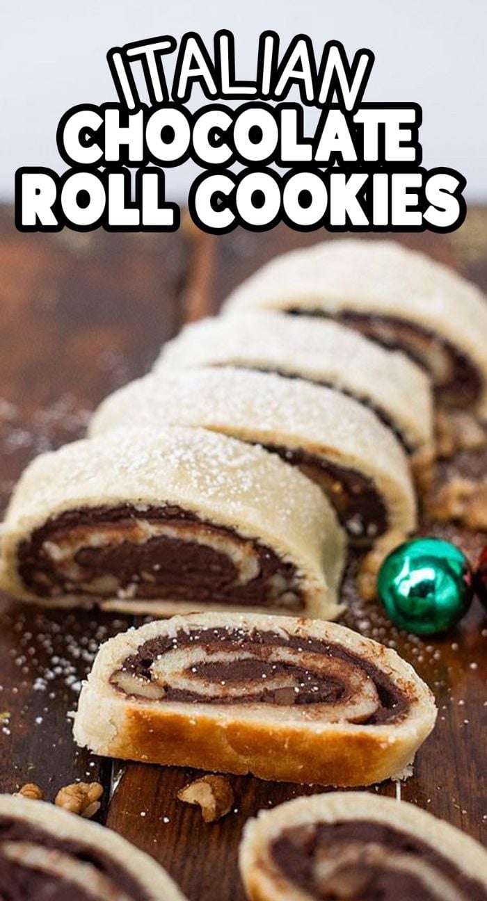 Sliced Italian chocolate roll cookies on a wooden board, dusted with powdered sugar—perfect for holiday baking and festive gatherings.