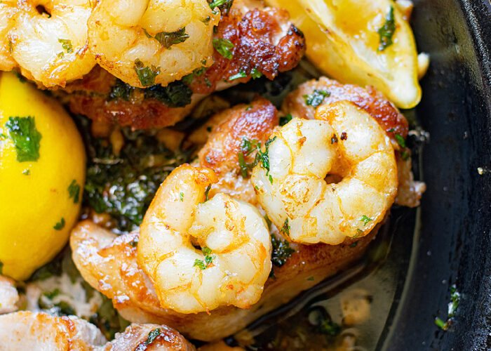 Food blogger, Bella Bucchiotti of xoxoBella, shares a recipe for pan seared pork chops! The butter herbed shrimp are tasty and this shrimp and pork chops recipe will be an instant favourite. This will be your go-to easy pork chops recipe.