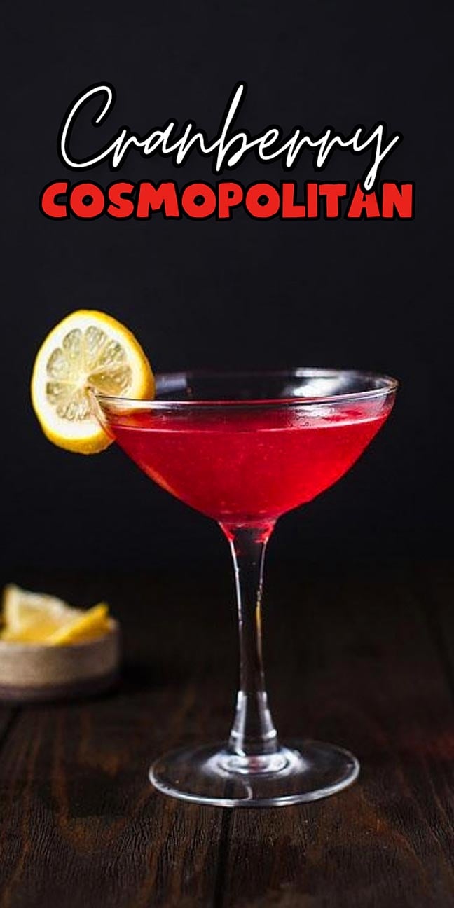 Cranberry Cosmopolitan cocktail in a martini glass with a lemon slice garnish.