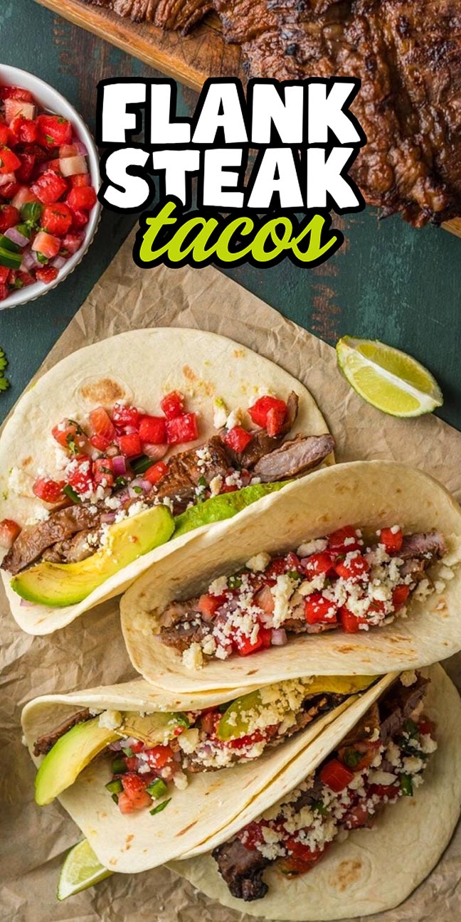 Three flank steak tacos topped with salsa, avocado, and crumbled cheese.