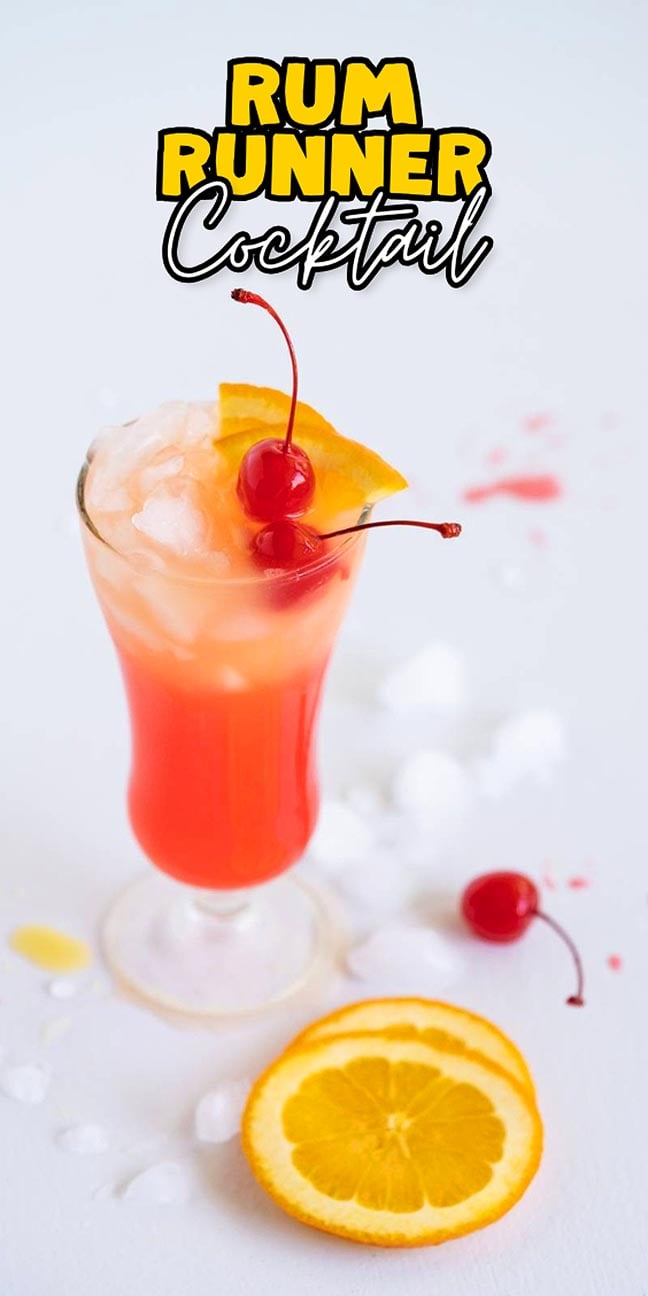A tall glass of Rum Runner cocktail with ice, cherry, orange slice, and cocktail text above.