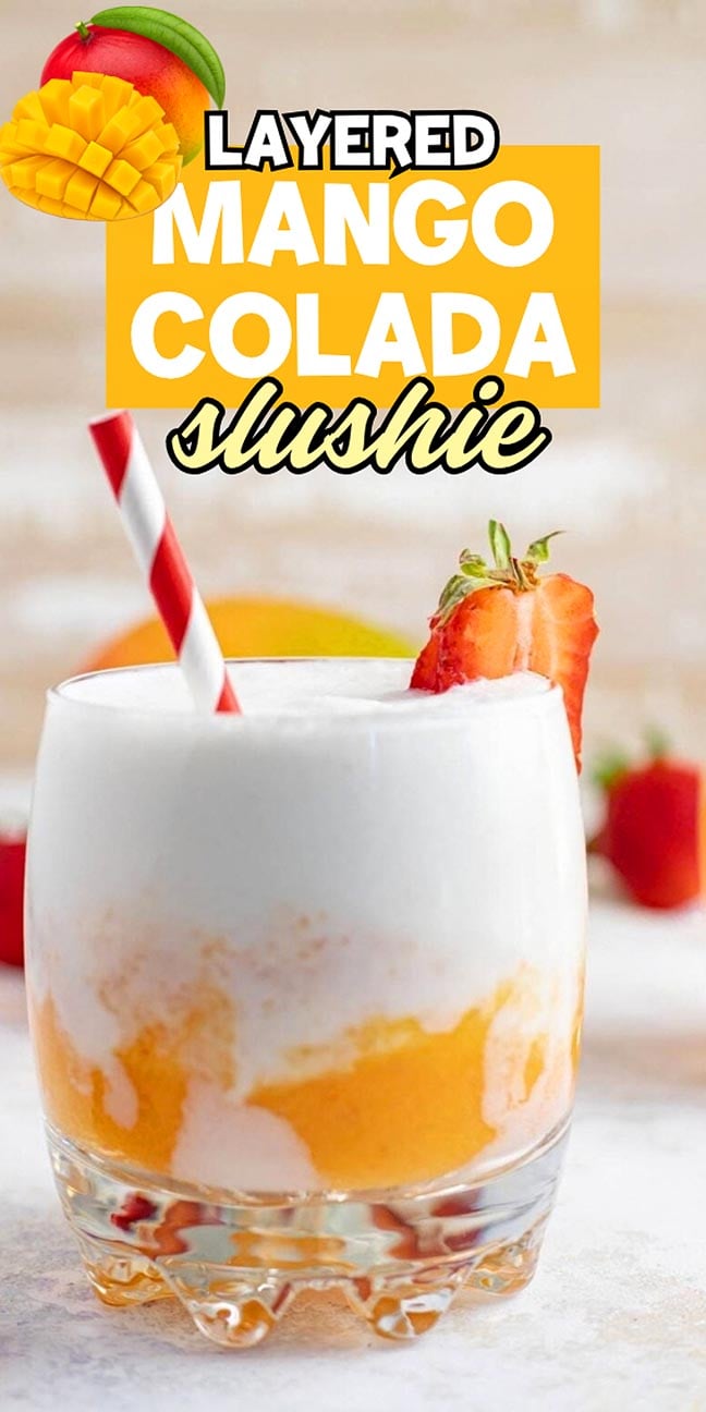 Layered mango colada slushie with a striped straw and strawberry garnish.