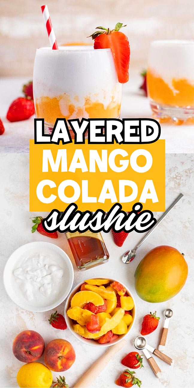 Layered mango colada slushie in a glass with a straw, surrounded by fresh mangoes, strawberries, and coconut cream.