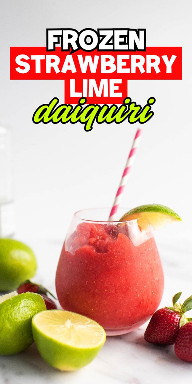Frozen strawberry lime daiquiri with a pink striped straw, lime wedge, and fresh fruit.