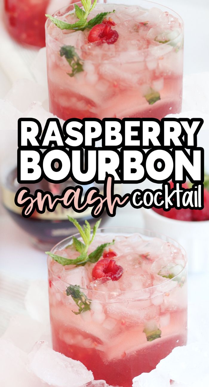 A glass of raspberry bourbon smash cocktail with crushed ice, mint, and raspberries, garnished with a mint sprig—an ideal bourbon holiday drink for any celebration.