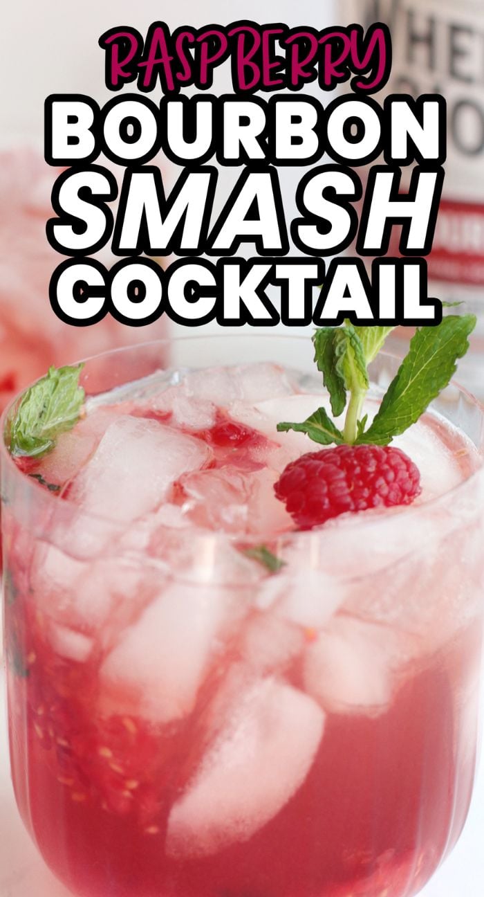 Iced Raspberry Bourbon Smash Cocktail garnished with mint and a raspberry, text reads “Raspberry Bourbon Smash Cocktail”—a refreshing cocktail with raspberries perfect for your next bourbon drink recipe adventure.