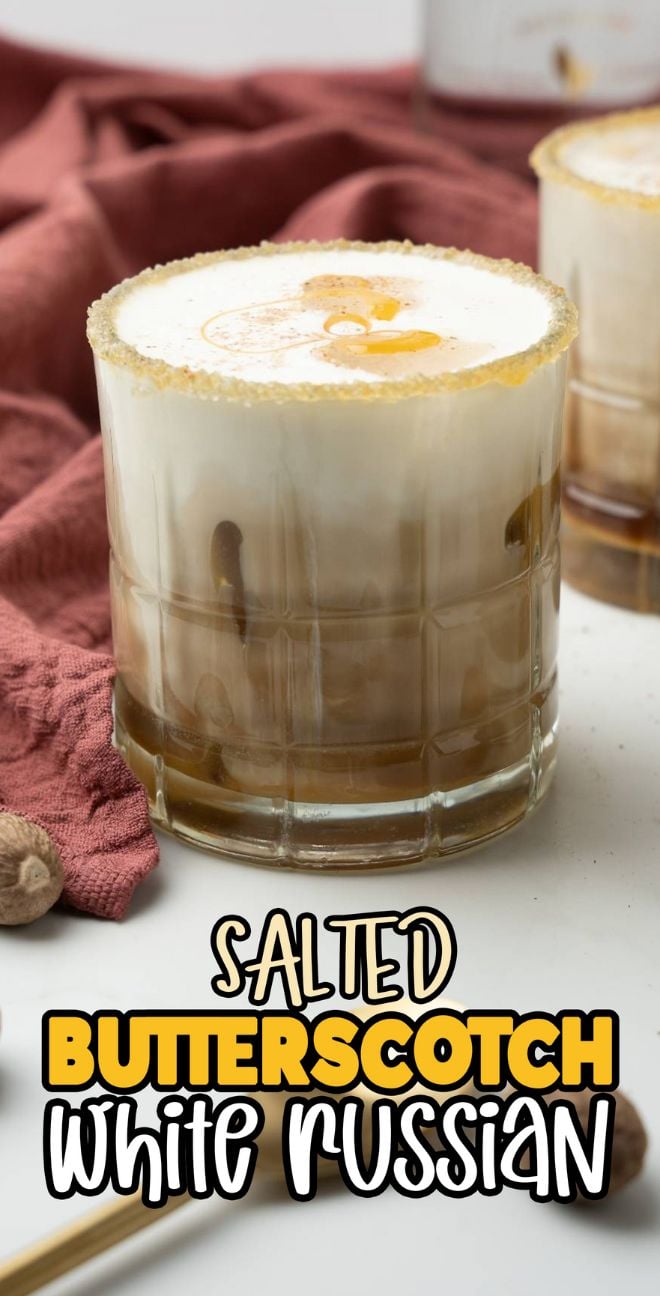 A glass of Salted Butterscotch White Russian, using butterscotch schnapps and coffee liqueur, sits with a creamy top next to a red napkin—the best autumn cocktail for cozy evenings.