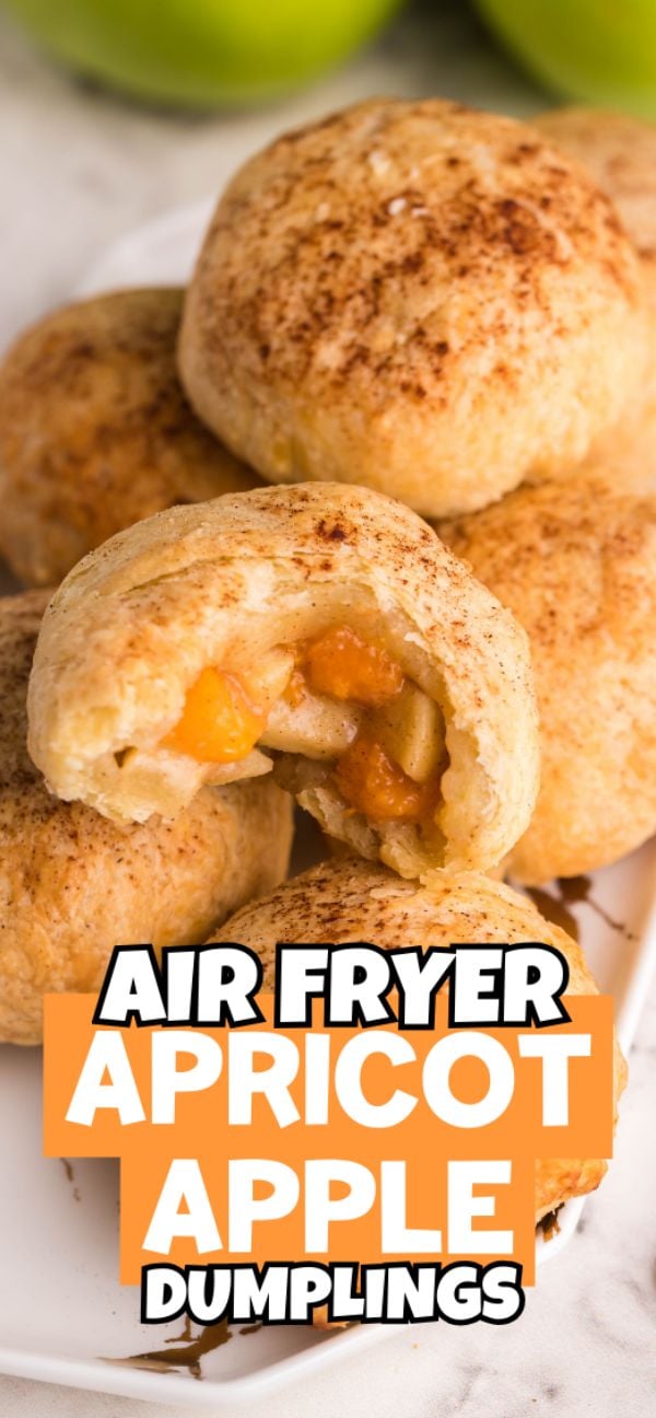 Air Fryer Apricot Apple Dumplings on a plate, with one cut open to reveal the fruity filling—these puff pastry dumplings make the perfect autumn air fryer dessert.