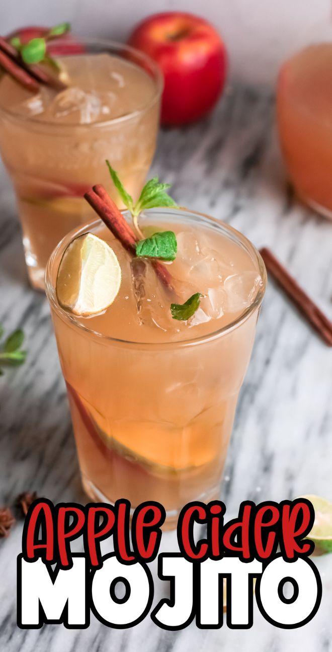 Spiked apple cider mojito with lime, mint, and a cinnamon stick garnish in a glass on a marble surface—an autumn cocktail with cider perfect for the season.