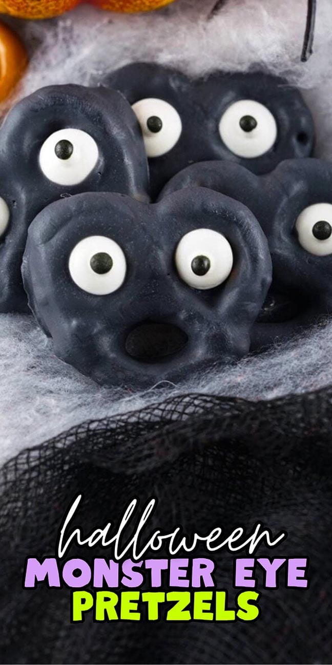 Black chocolate-covered pretzels with candy eyes, labeled “Halloween Monster Eye Pretzels.”