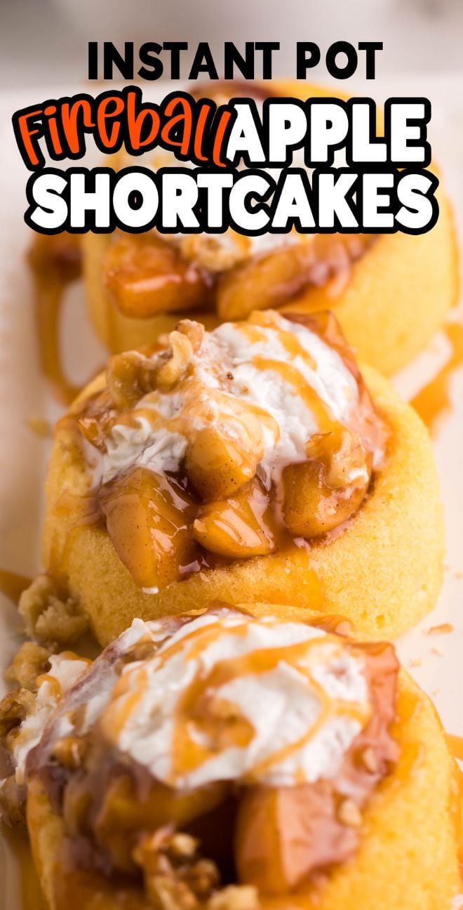 Three Instant Pot Fireball Apple Shortcakes topped with whipped cream, sauce, and walnuts on a white surface—an Autumn Instant Pot dessert perfect for any fireball whiskey dessert recipe lover.