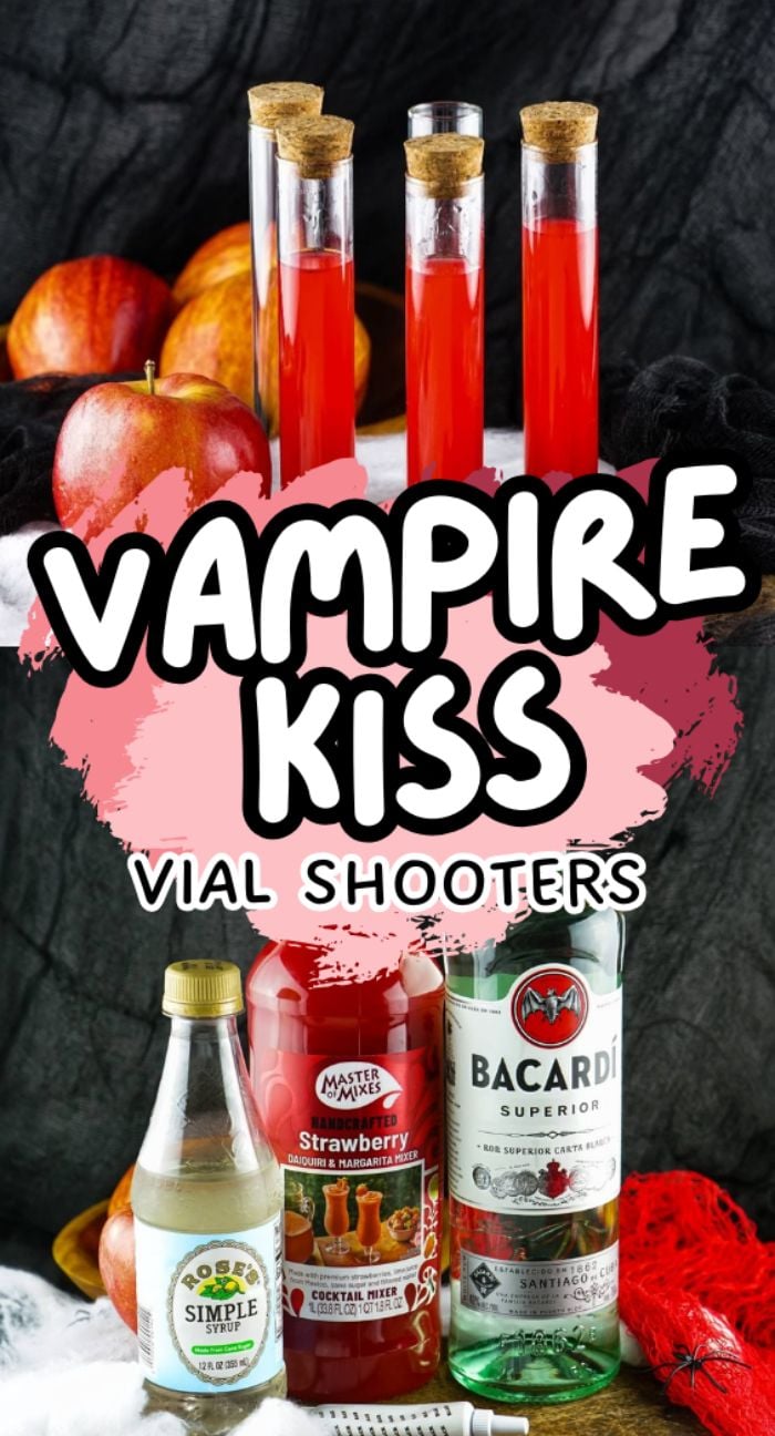 Three red test tube drinks labeled "Vampire Kiss Halloween Vial Shooter"—an eye-catching choice for alcoholic shots for Halloween—are pictured with apples, rum, syrup, and mixer in the background.