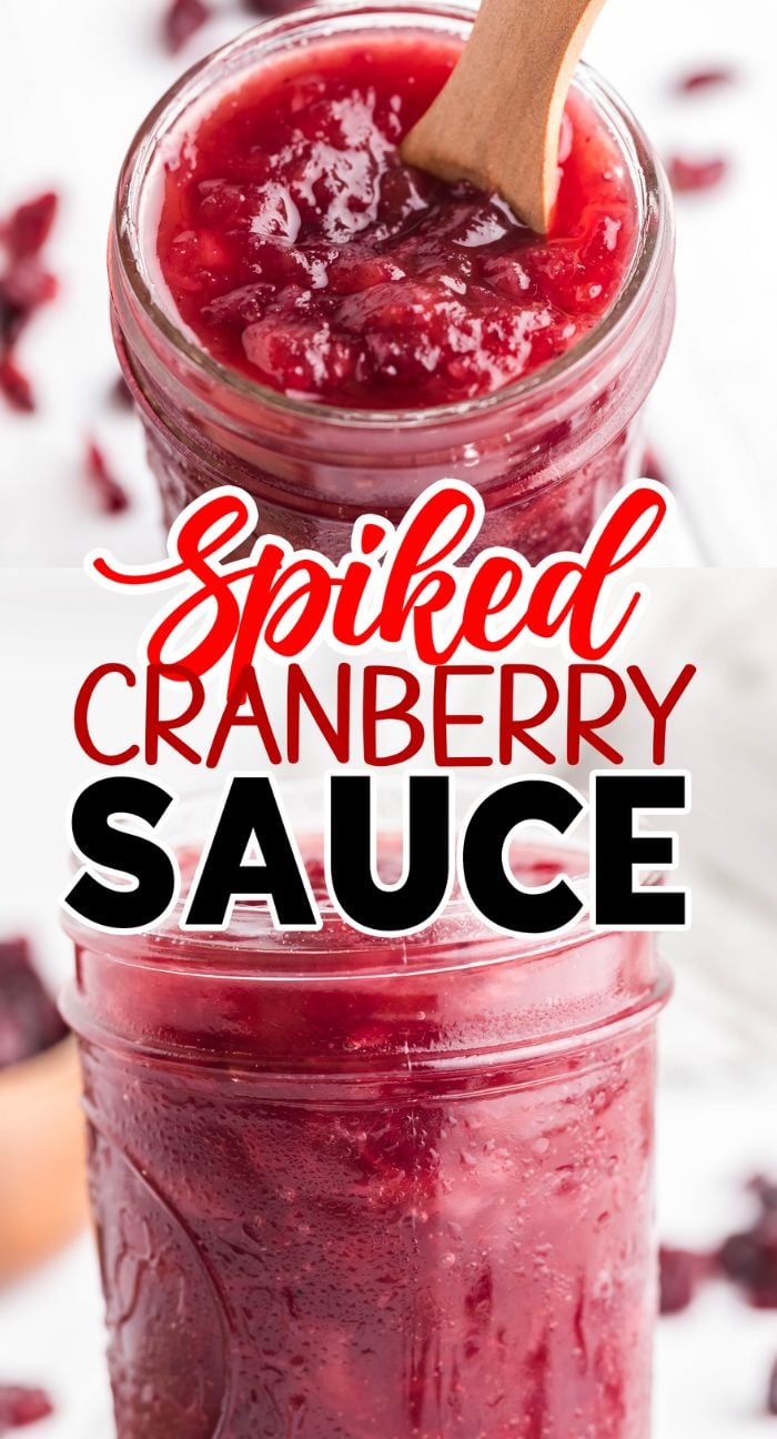 A jar of Spiked Cranberry Sauce with a wooden spoon, labeled "Spiked Cranberry Sauce," featuring the rich flavors of cranberry bourbon relish.