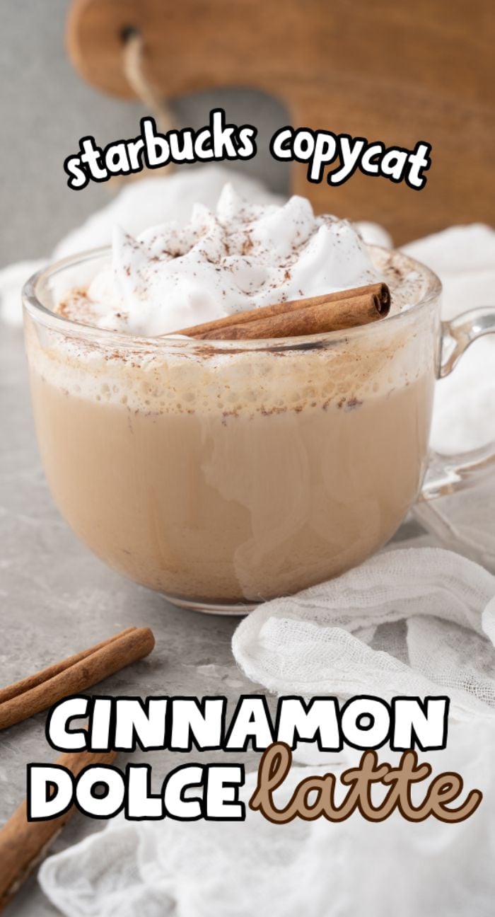 A clear mug of cinnamon dolce latte topped with whipped cream and a cinnamon stick, featuring text overlay—perfect for enjoying a Starbucks copycat latte at home.