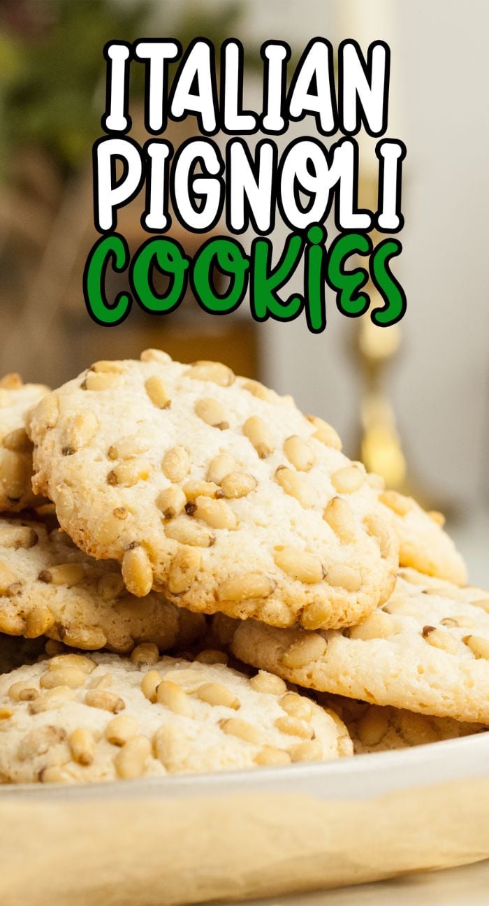 A plate of almond and pine nut cookies, known as Italian pignoli cookies, topped with pine nuts sits below text reading "Italian Pignoli Cookies"—perfect for easy gluten free holiday baking.