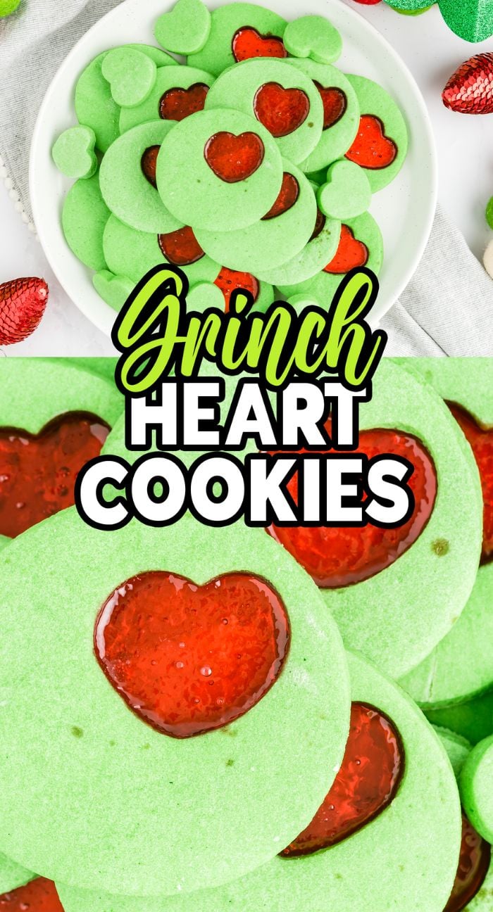 Green cookies with heart-shaped stained glass windows in red centers are arranged on a plate, labeled "Grinch Heart Cookies." These festive Grinch cookies are perfect for celebrating the holiday season.