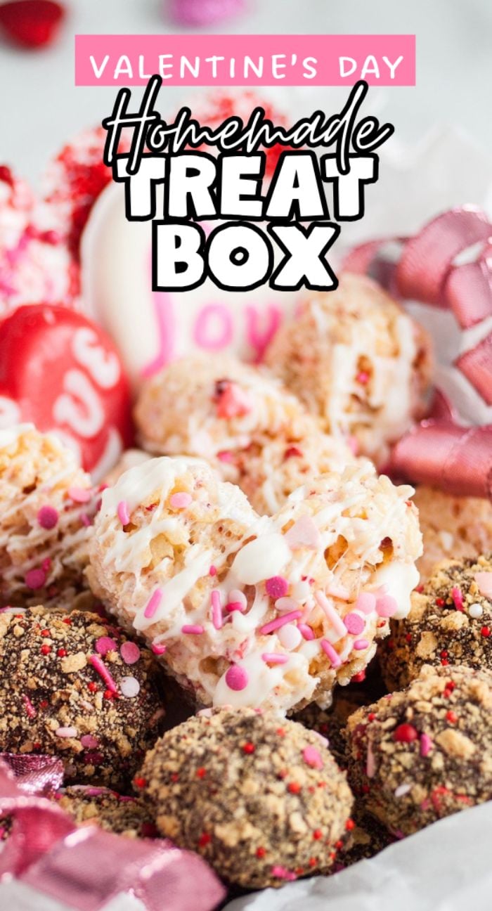 A close-up of assorted homemade Valentine's treats arranged in a festive valentine’s sweets gift box, topped with colorful sprinkles and pink decorations.