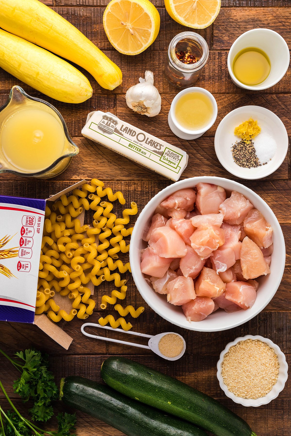 Enjoy a flavorful Instant Pot Lemon Chicken Pasta, made with chicken, pasta, squash, zucchini, lemons, broth, butter, and seasonings for a simple instant pot pasta dinner packed with fresh vegetables.