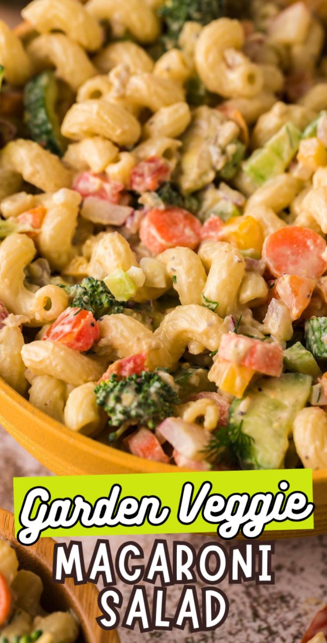 Close-up of macaroni salad with vegetables—broccoli, carrots, and peppers—in a yellow bowl, tossed in a creamy avocado dressing. Text reads "Garden Veggie Macaroni Salad.