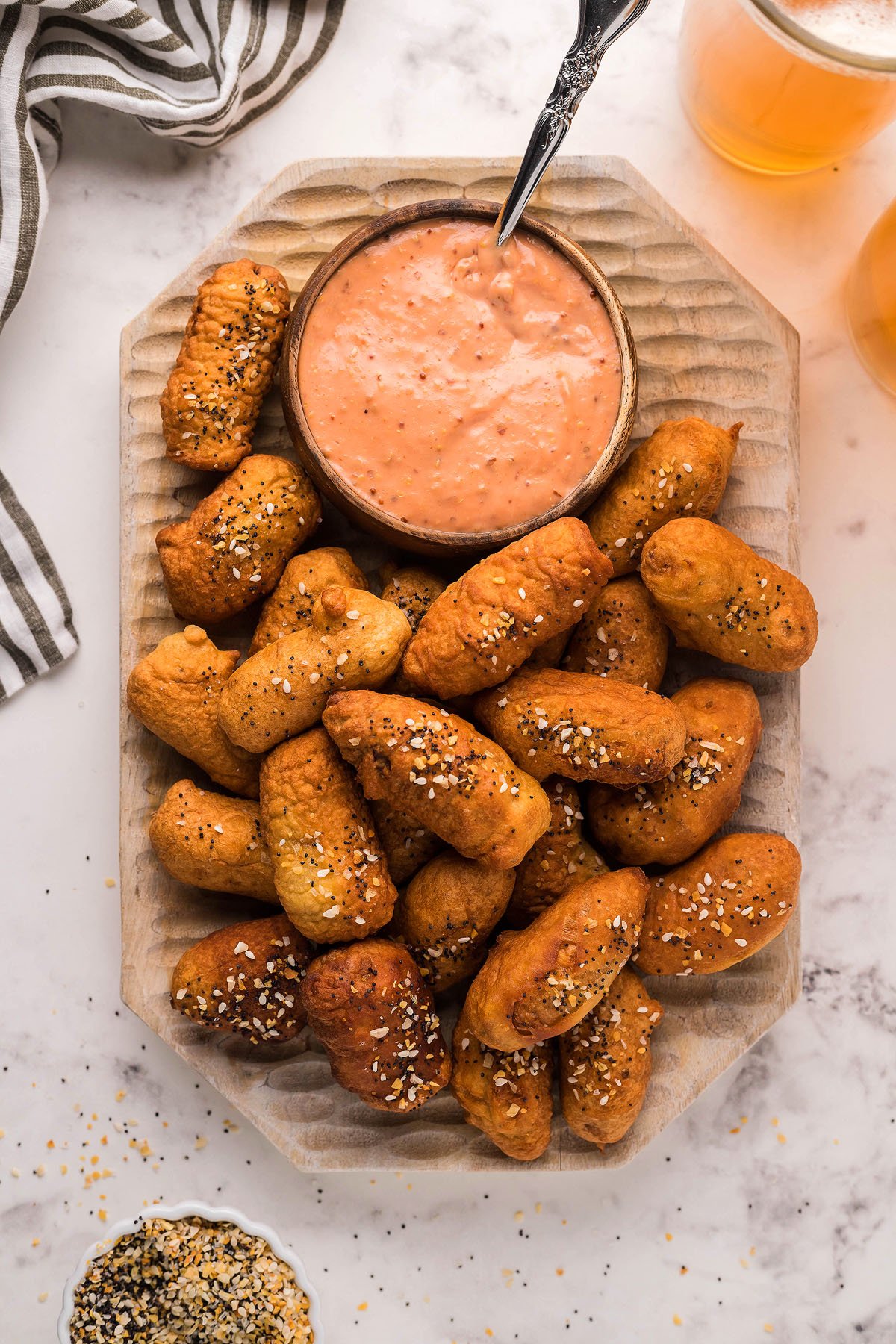 A platter of soft pretzel bites and cocktail weenies, served with a bowl of creamy, easy horseradish mayo dipping sauce.