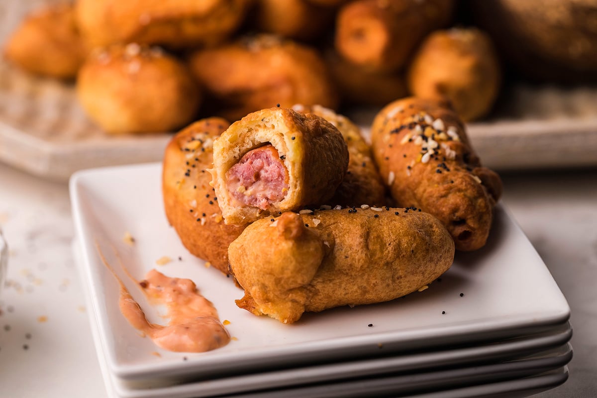 Bagel beer dogs on a plate.