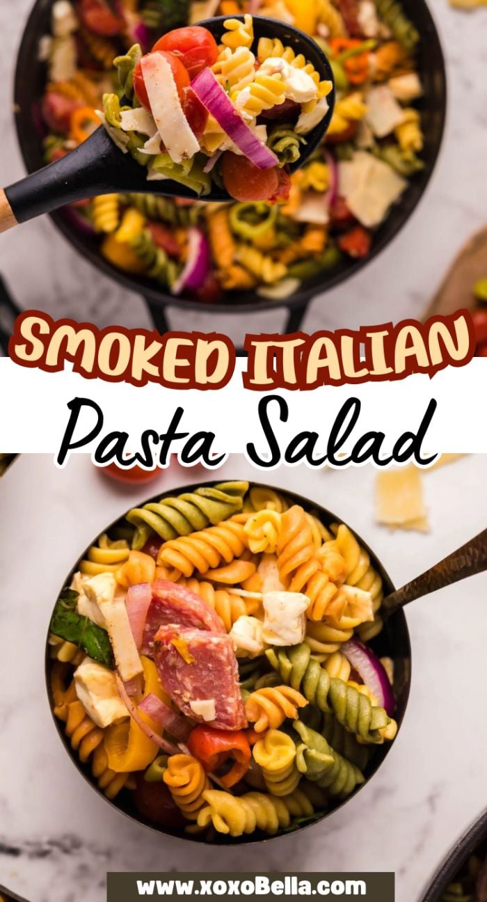 Colorful pasta salad with vegetables, salami and mozzarella cheese, Italian meats, and Pepperoncini Dressing served in a black bowl with a serving spoon.