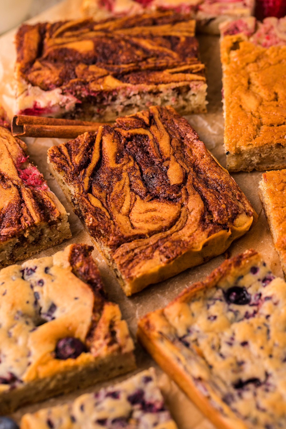 Assorted sliced dessert bars with swirled and marbled patterns, reminiscent of Sheet Pan Buttermilk Pancakes—it's the ultimate pancake hack for enjoying pancakes baked in the oven.