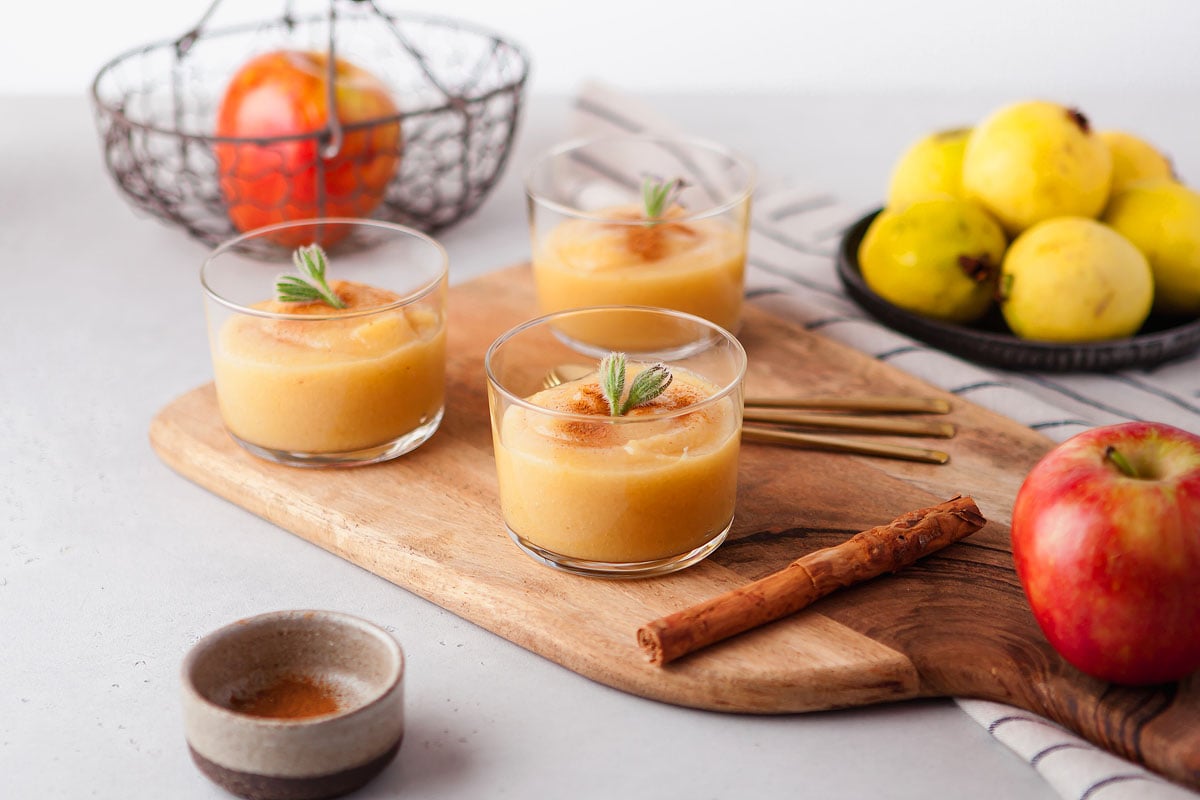 Small clear dishes with guava applesauce.