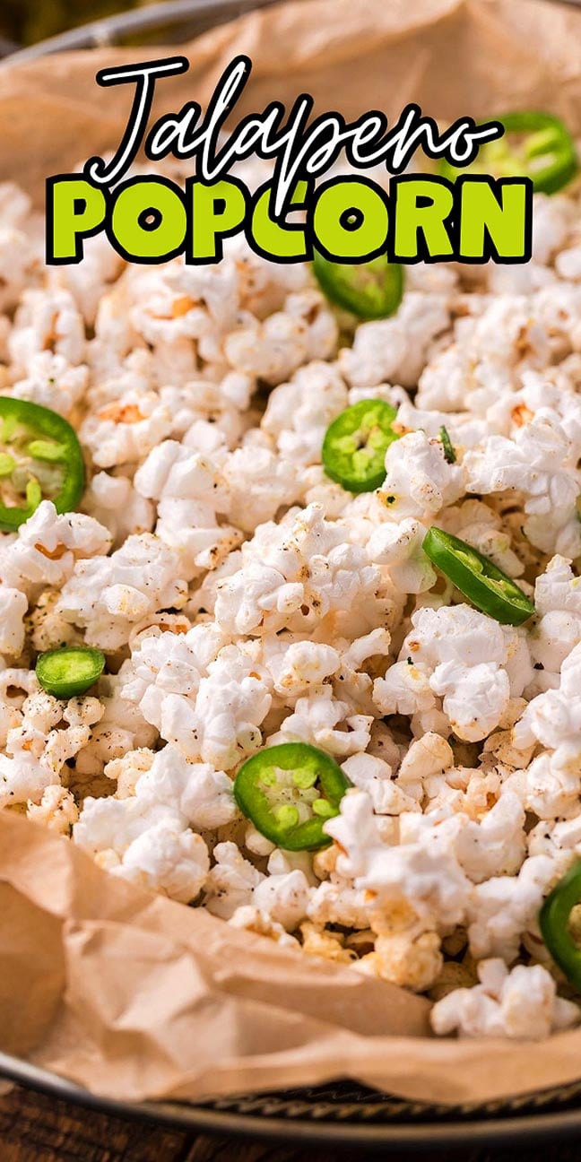Popcorn topped with sliced jalapeños on parchment paper, with “Jalapeno Popcorn” text above.