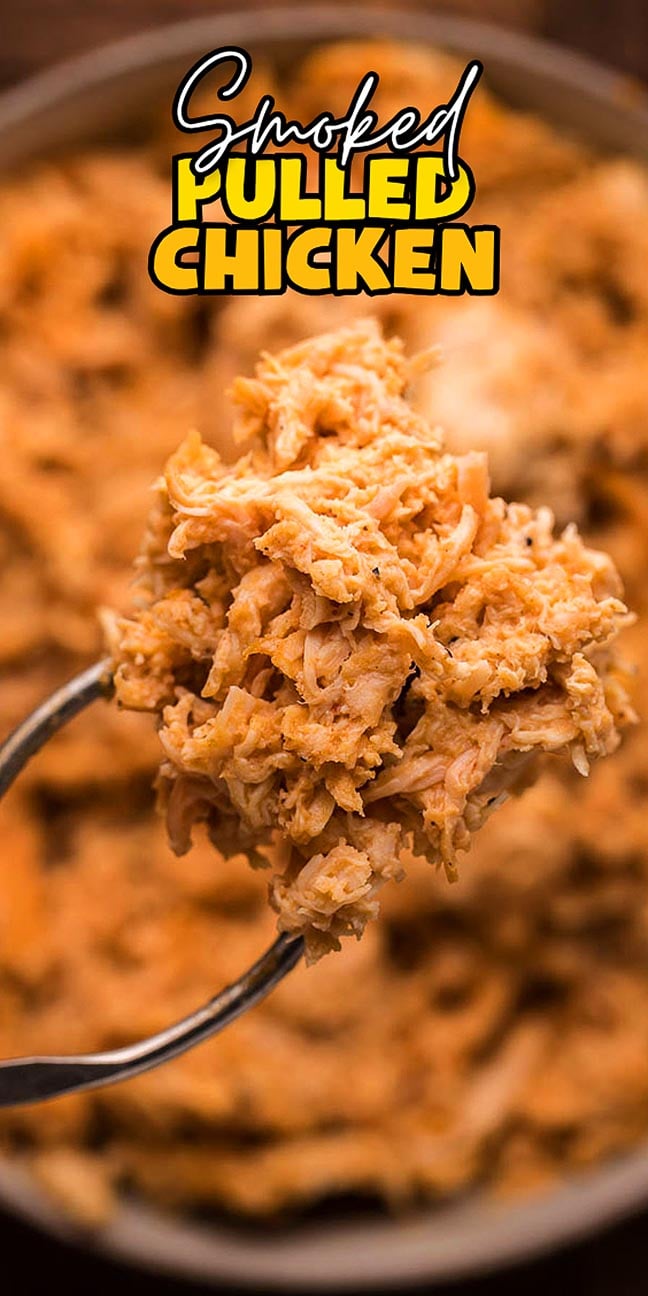 A fork holds smoked pulled chicken, with more shredded chicken in a bowl and text reading “Smoked Pulled Chicken.”.