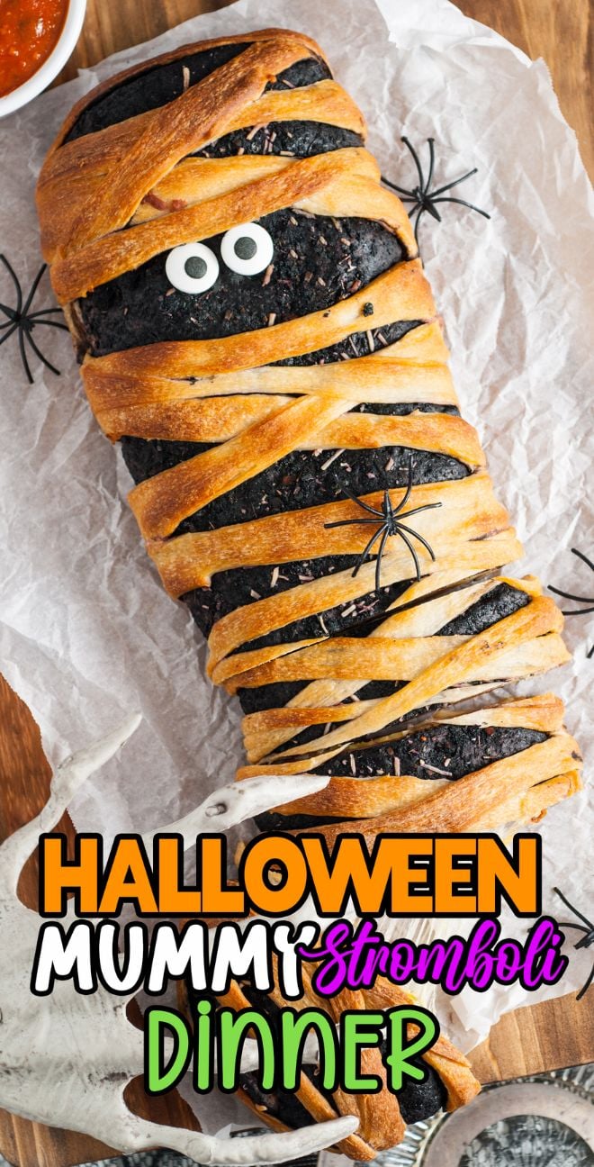A homemade stromboli wrapped like a mummy with candy eyes and fake spiders—perfect for your Halloween dinner or appetizer! “Halloween Mummy Stromboli Dinner” text completes this spooky treat.
