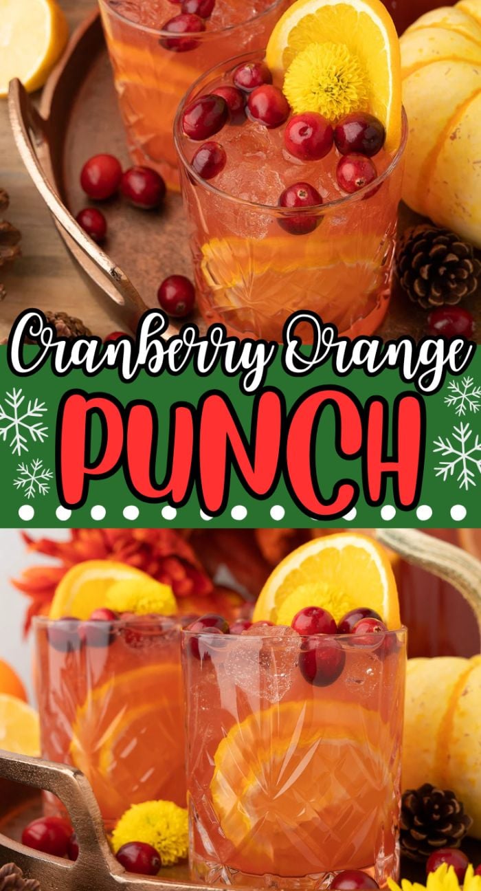 Two glasses of Cranberry Orange Prosecco Punch garnished with orange slices and cranberries, surrounded by festive decor—the perfect Thanksgiving punch for your holiday celebration.