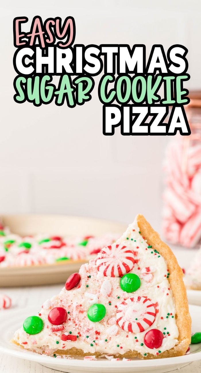 A slice of Holiday Cookie Pizza made with refrigerated sugar cookie dough, topped with white frosting, red and green candy toppings, and festive sprinkles.