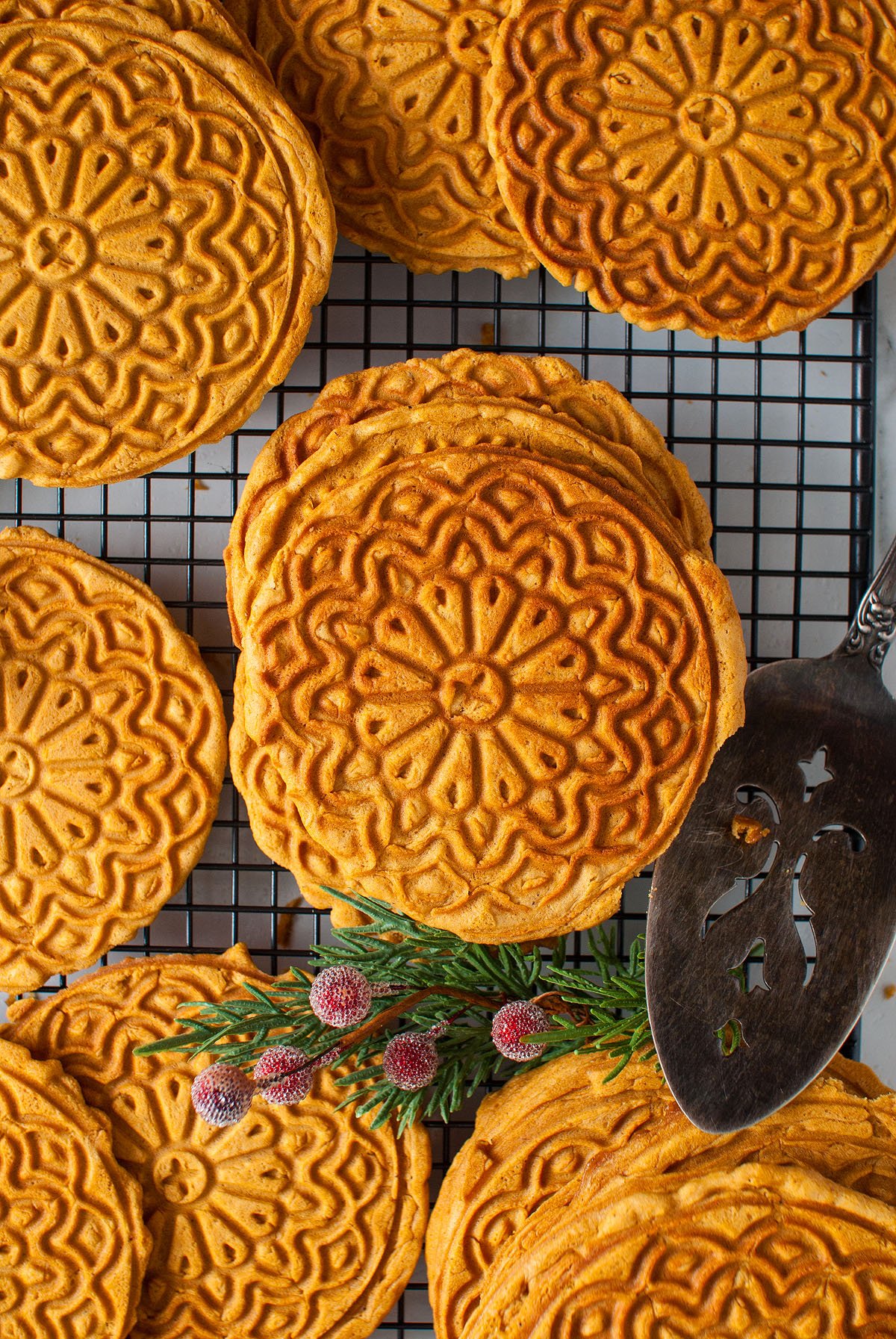 Food blogger, Bella Bucchiotti of xoxoBella, shares a gingerbread pizzelle recipe. Christmas pizzelles are a classic Italian cookie made in an iron or press.