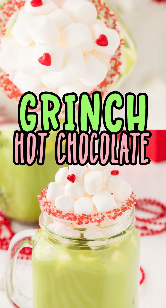 A green mug of Green Grinch hot chocolate topped with marshmallows and red candy hearts, rimmed with sparkling red sugar.