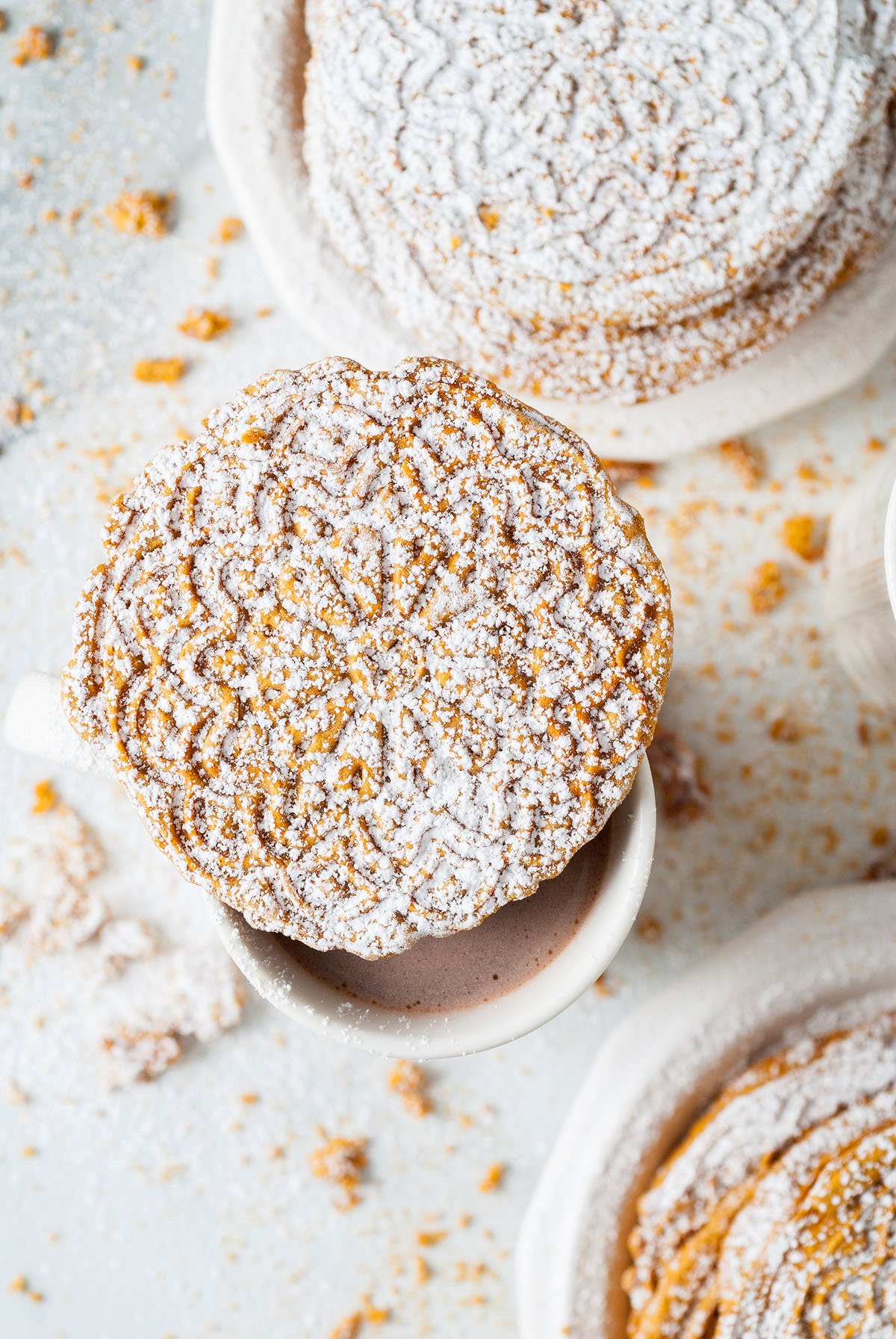 Food blogger, Bella Bucchiotti of xoxoBella, shares a gingerbread pizzelle recipe. This thin waffle like Italian Christmas cookie is a holiday tradition.