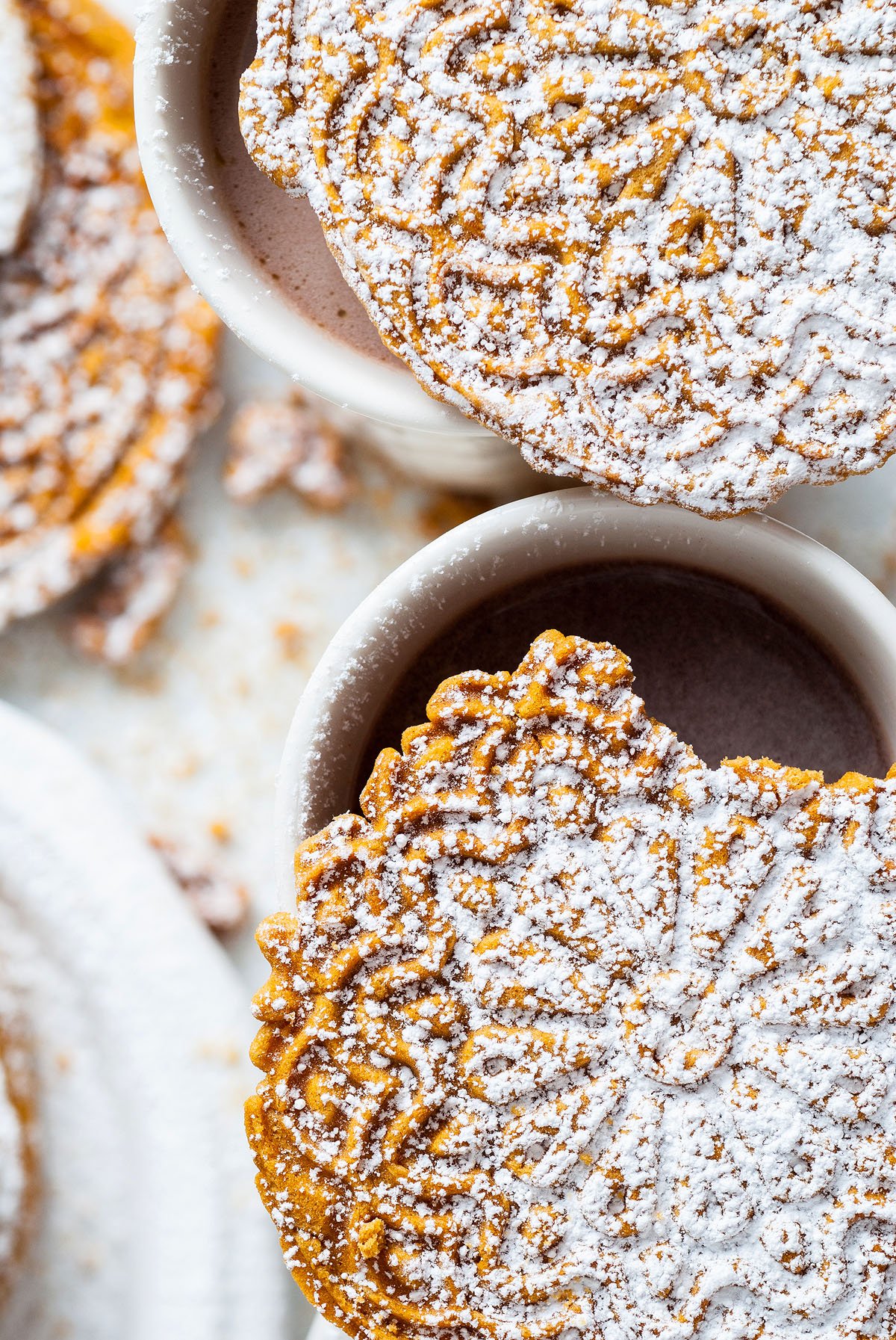 Food blogger, Bella Bucchiotti of xoxoBella, shares a gingerbread pizzelle recipe. Christmas pizzelles are a classic Italian cookie made in an iron or press.