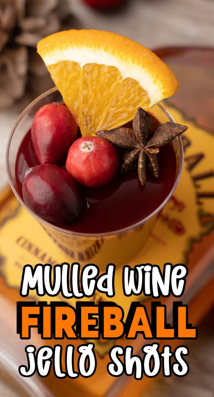 A festive Fireball jello shot recipe, these Mulled Wine Fireball Jello Shots are garnished with orange, cranberries, and star anise—perfect for your collection of Christmas shot recipes.
