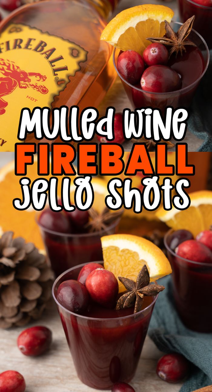 Three Mulled Wine Fireball Jello Shots, garnished with cranberries, orange slices, and star anise, sit near a Fireball bottle—perfect for festive gatherings or trying fun Christmas shot recipes.