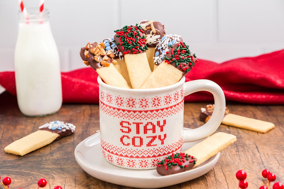 Stay cozy Christmas cookie sticks in a mug.