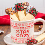 Food blogger, Bella Bucchiotti of xoxoBella, shares a recipe for easy dipped sugar cookie sticks. These chocolate dipped stick shaped cookies are so easy to make!
