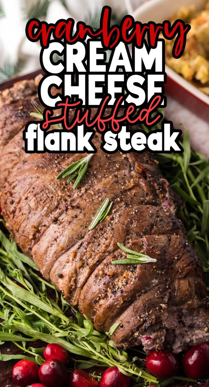 Enjoy this Cranberry Cream Cheese Stuffed Flank Steak—an elegant Thanksgiving or Christmas steak recipe featuring seasoned flank steak filled with cranberry cream cheese, then garnished with rosemary and fresh cranberries.