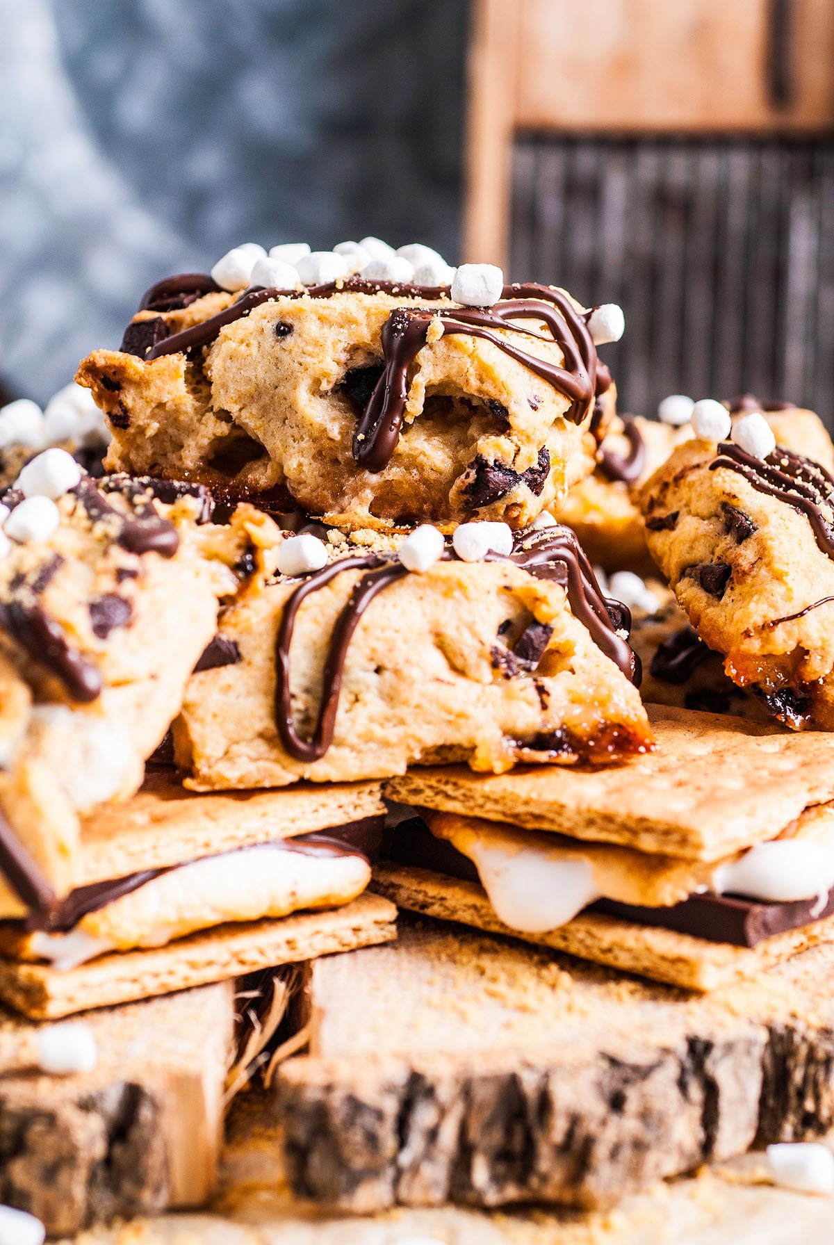 Chocolate chip cookie s'mores with melted chocolate and mini marshmallows stacked on graham crackers—these treats are inspired by our favorite S’more Scones, bringing that delicious scones recipe twist to a campfire classic.
